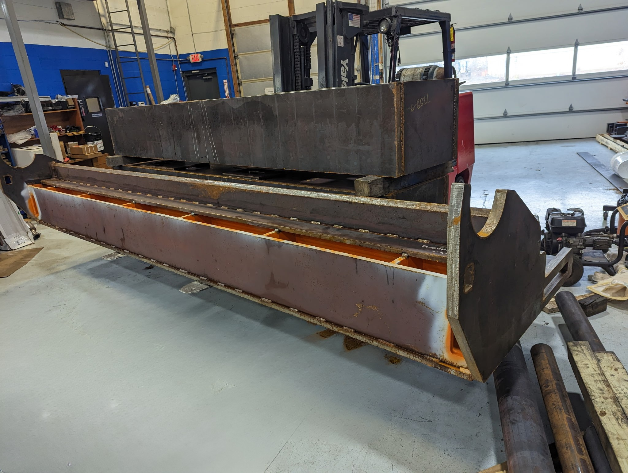 Large steel component fabrication in industrial machining workshop